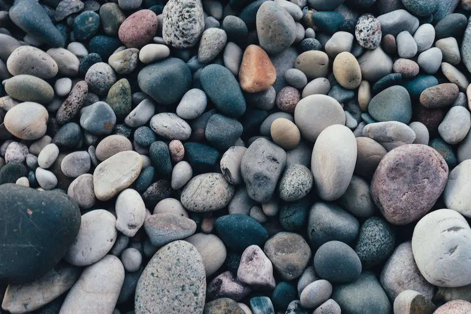 An image showing a game of Kluster being played with stones scattered on a table