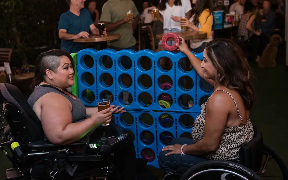 A group of people playing Connect 4, focused on the game with smiles on their faces