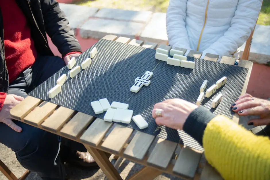 A group of people sitting around a table, playing Mexican Train Dominoes and having fun.