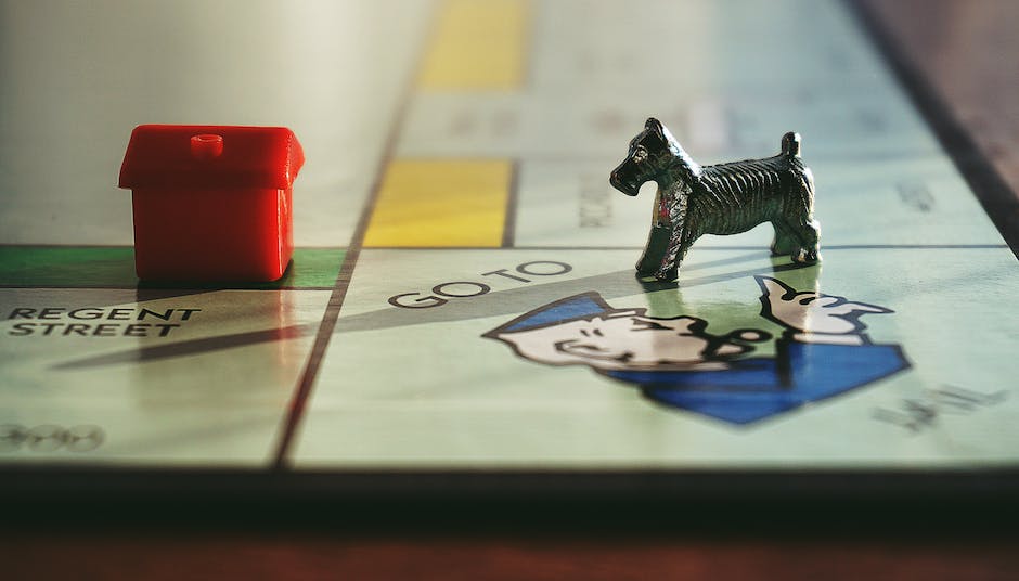 A picture of the box cover of Monopoly Cheaters Edition showing the classic Monopoly board game with some play money and red background.