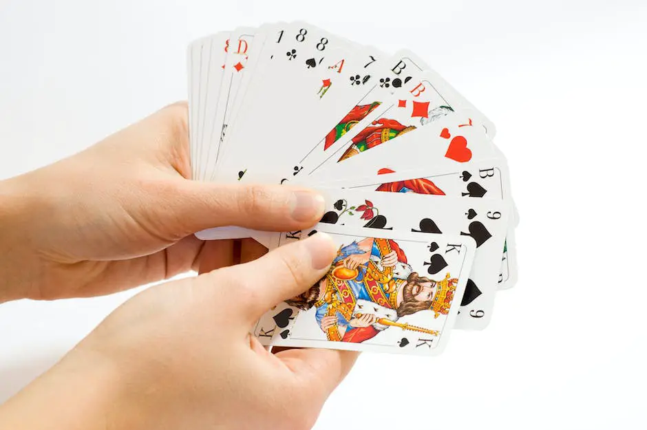 A person sitting at a table with a deck of cards in his hand, contemplating his next move while others watch keenly.